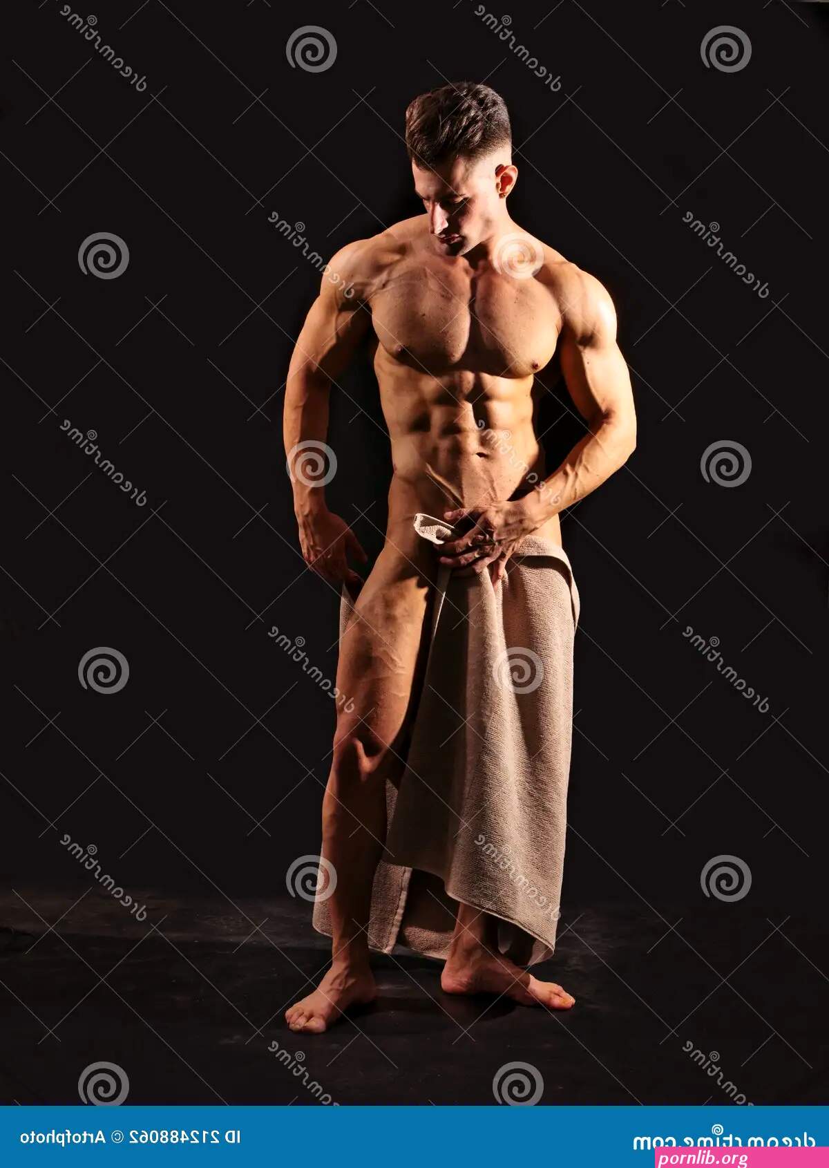 Totally Naked Muscular Bodybuilder Young Man in Studio Stock Photo