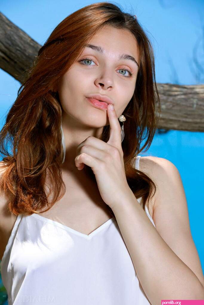 Olga Rich in Redhead with puffy nipples outside