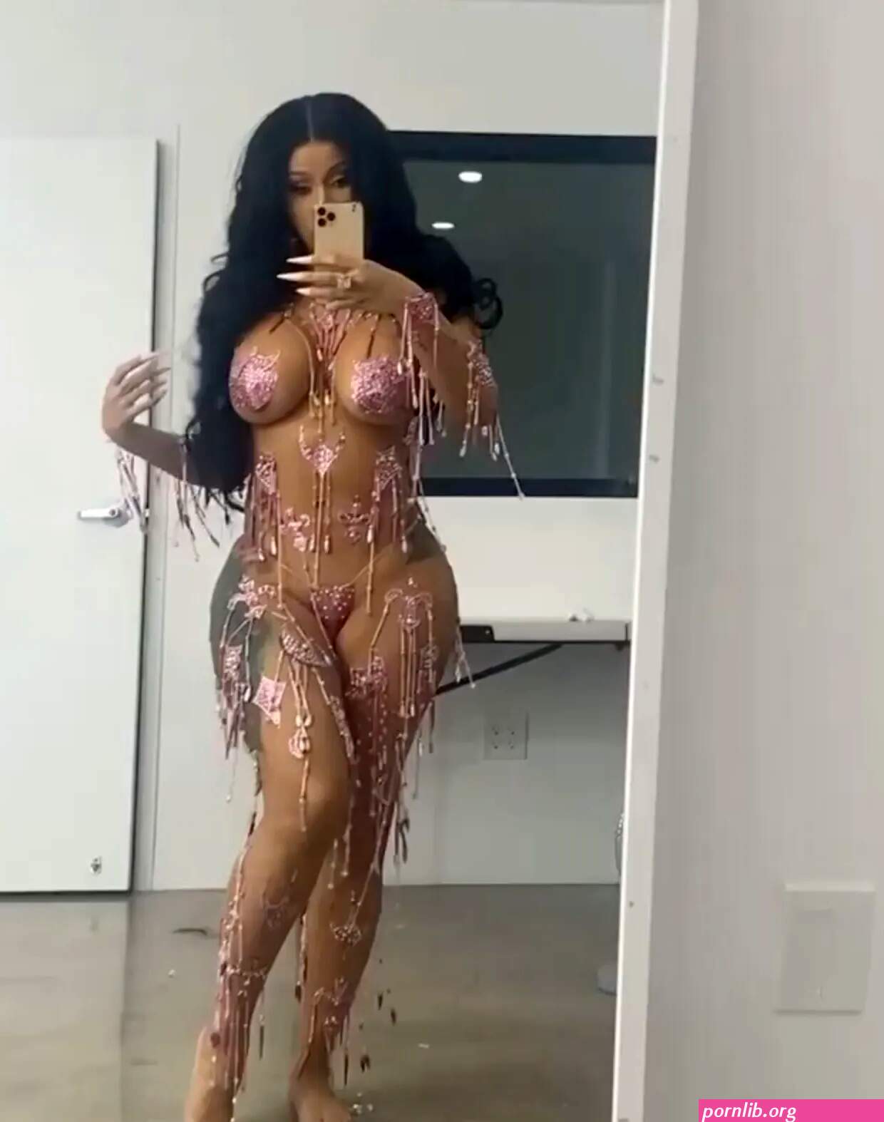 Cardi B goes nearly nude dances in JUST pink stickers beads as she promotes new single UP