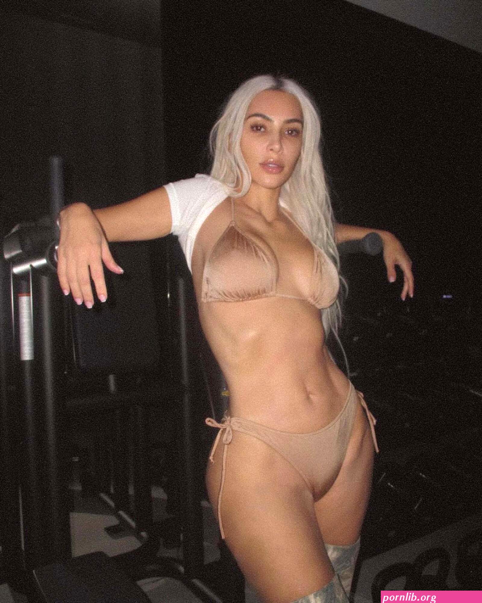 Kim Kardashian hits the gym in nude bikini and thigh-high boots