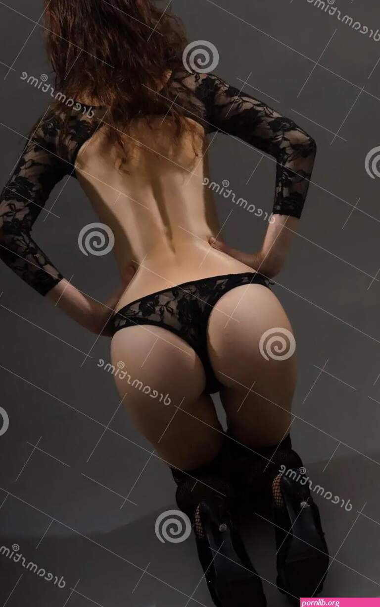 Young Woman with a Big Ass Seen from Behind. Stock Photo