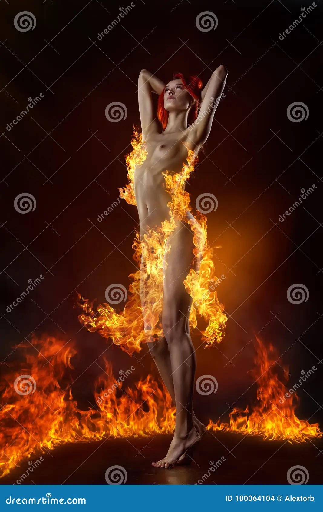 Dancing Naked Redhair Girl Dressed in a Fire Dress Stock Photo