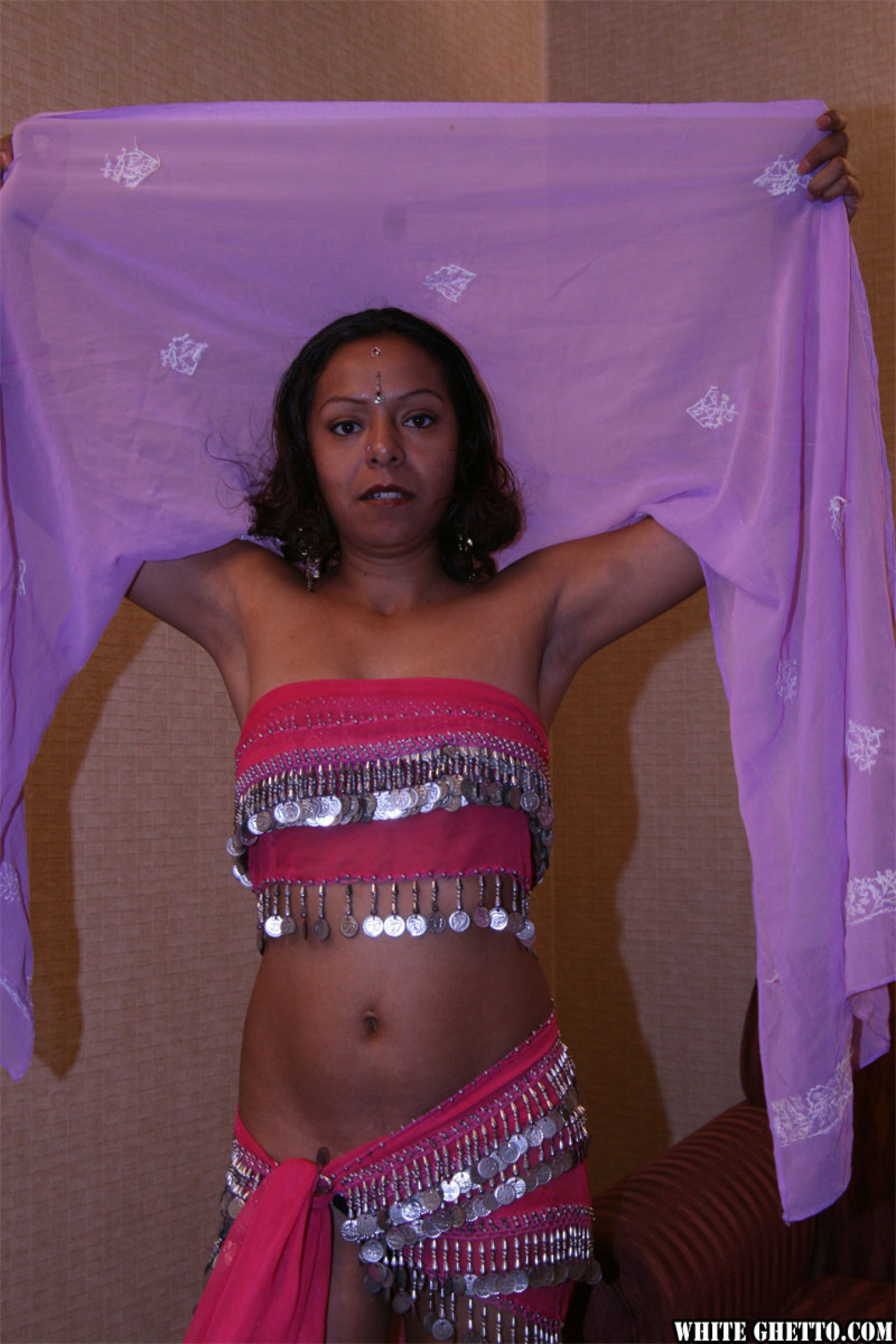 Sexy India slut Sita taking her clothes off and revealing natural tits