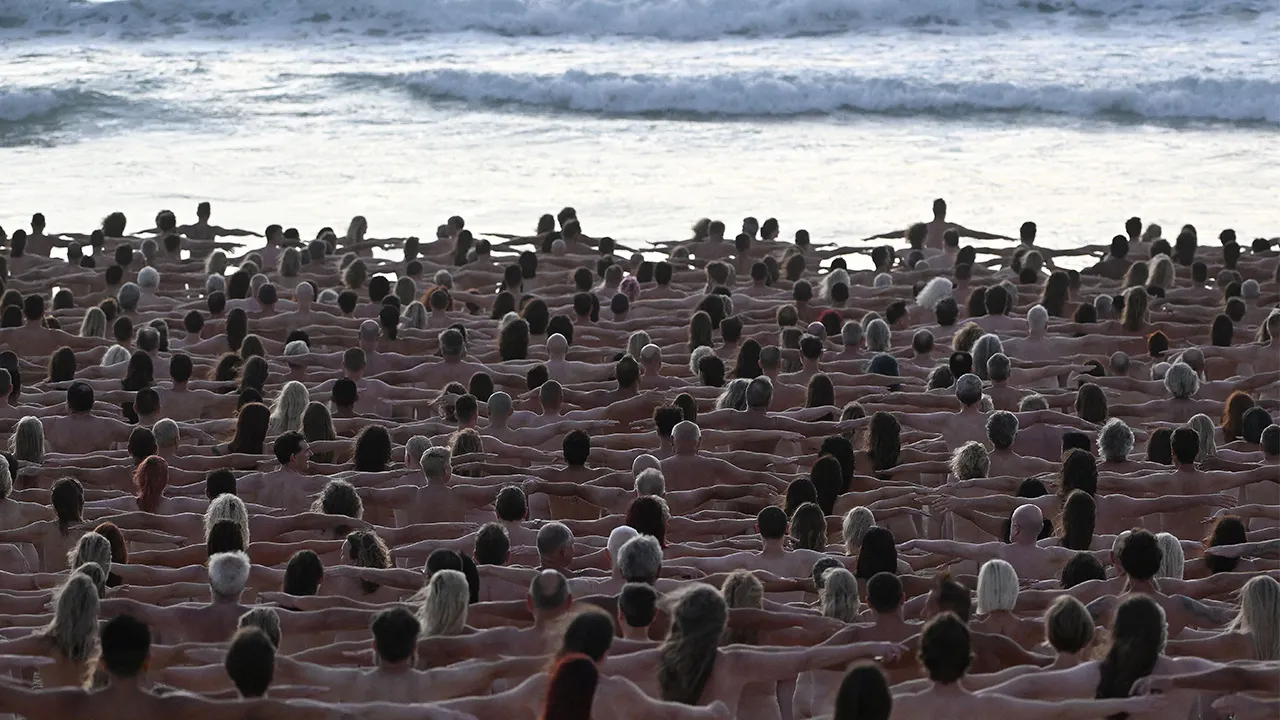 Hundreds pose nude on Australian beach to raise awareness for skin cancer