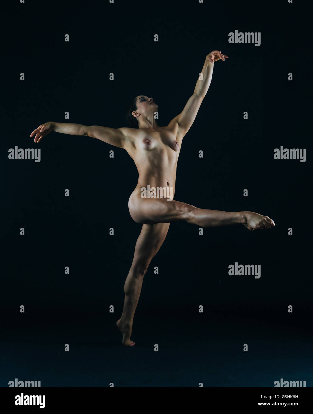 Full length view of nude dancer in pose Stock Photo