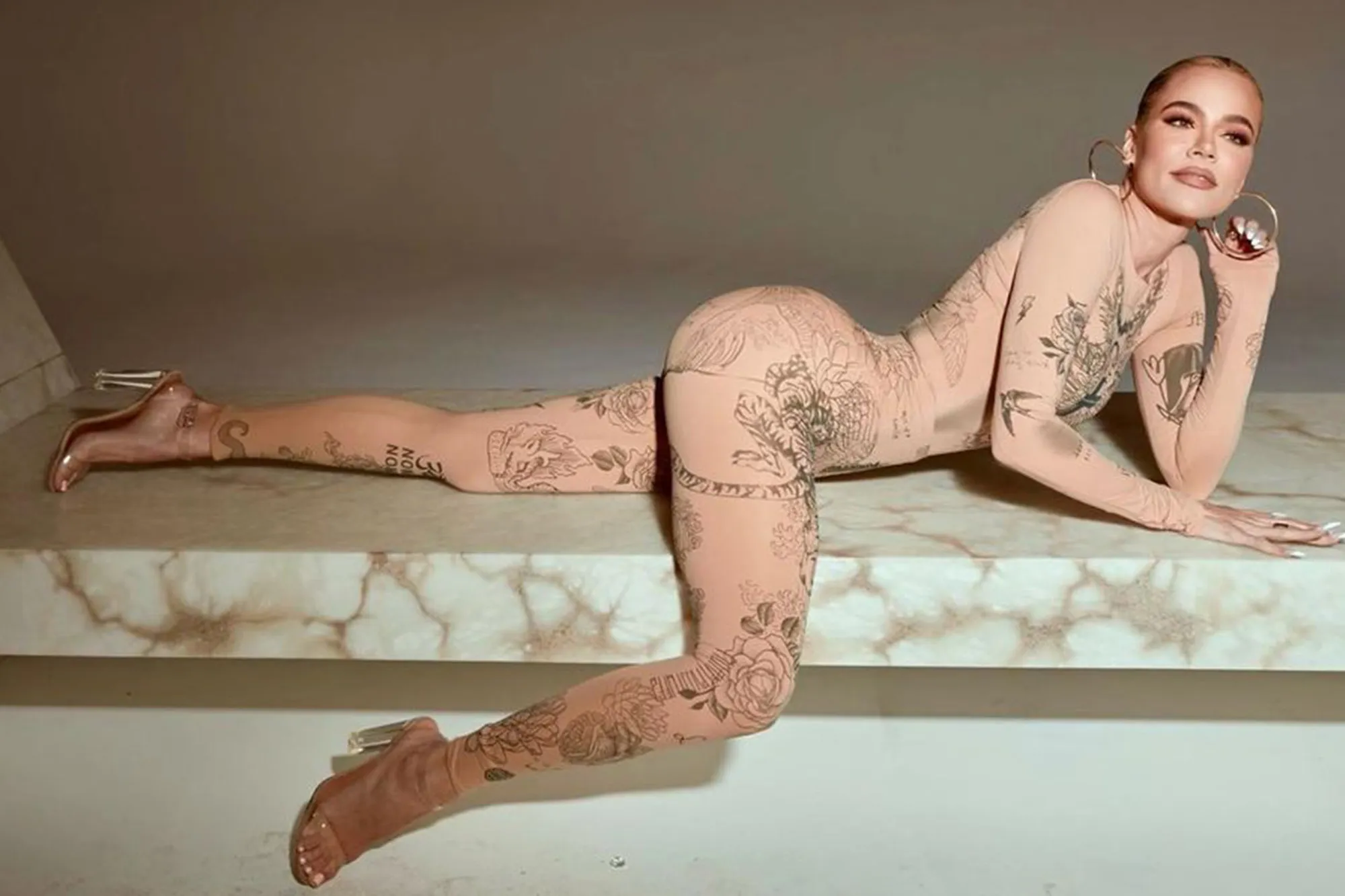 Khloé Kardashian rocks nude catsuit covered in tattoos