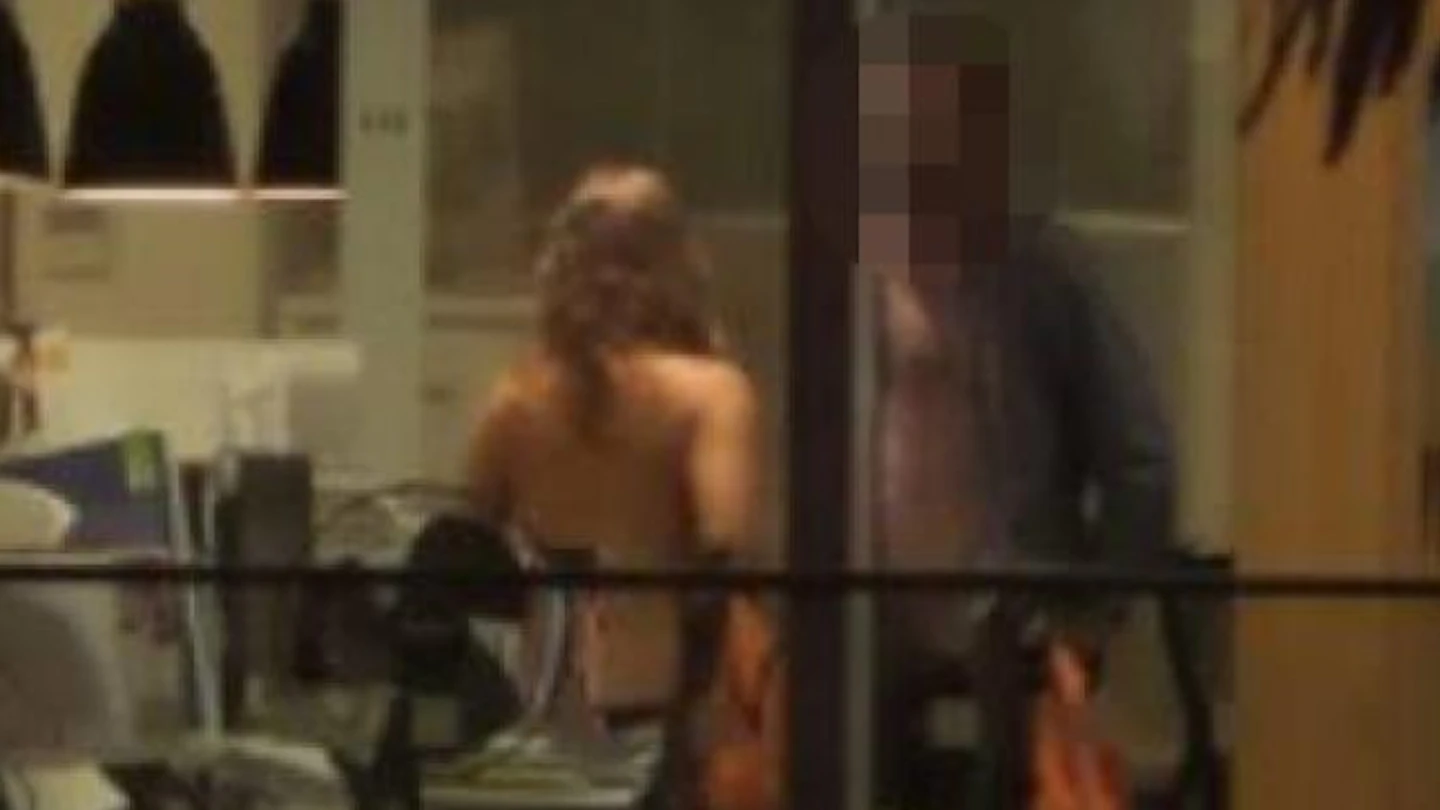 Pub goers cheer on couple having sex in office with lights on