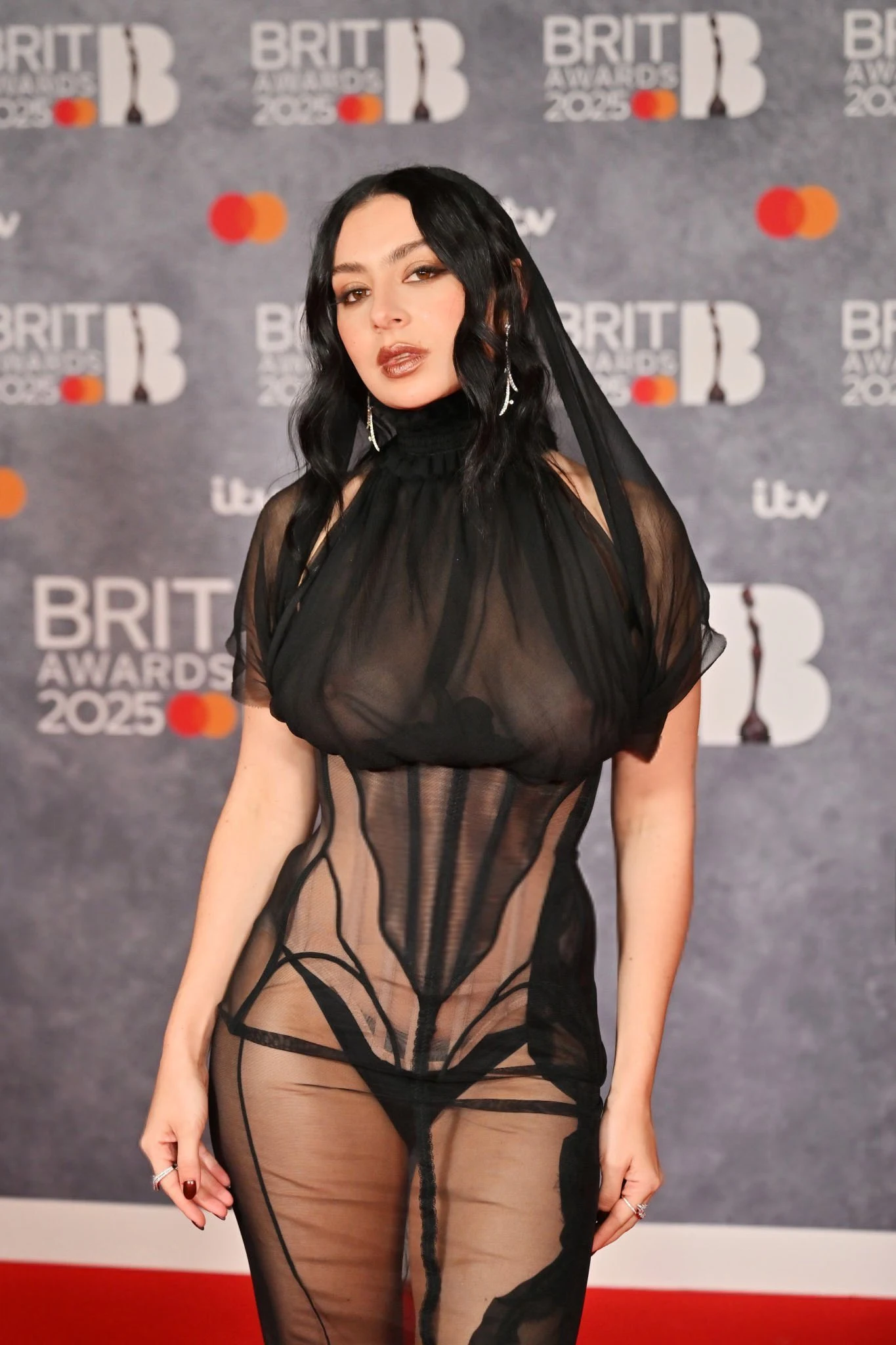 Charli XCX Turns Heads in Sheer Black Gown at the 2025 BRIT Awards