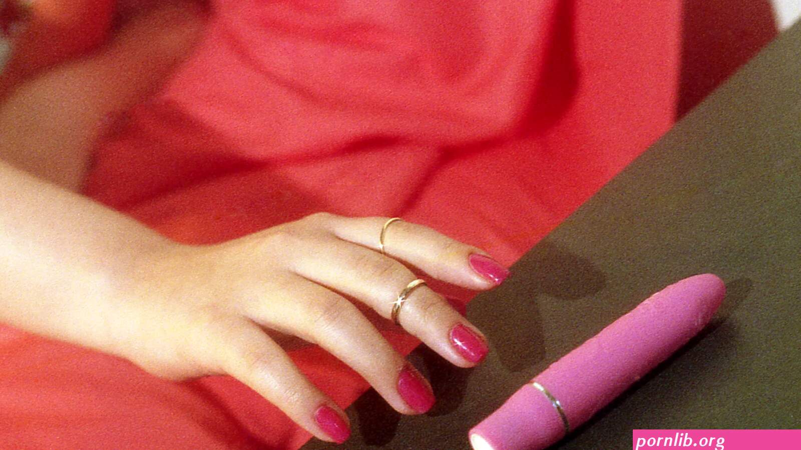 Porn: using a red dildo